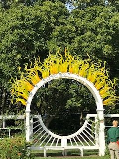Dale Chihuly's sun rays on a garden gate at the Missouri Botanical Gardens